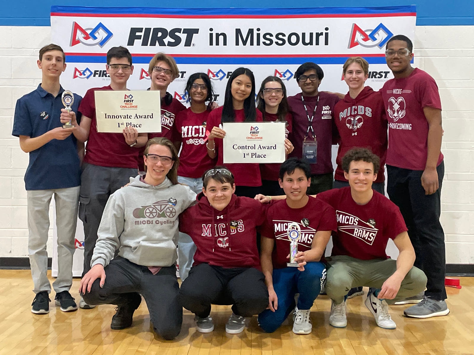 The full Ramifications #5155 team holding their FIRST Control Award and Innovate Award, 1st place, at FIRST in Missouri.